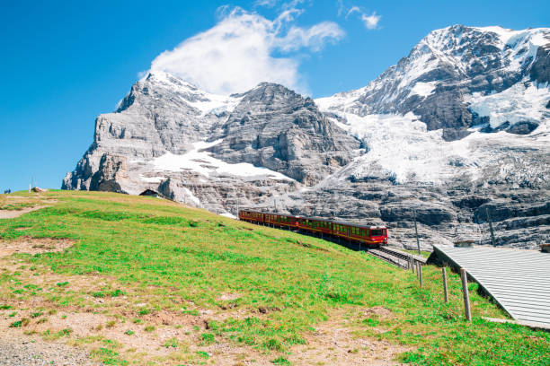 istock Snowy mountain and train at Jungfrau Eigergletscher in Switzerland 940728322
