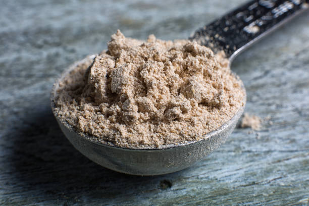 istock barley flour closeup in measuring spoon 940730846