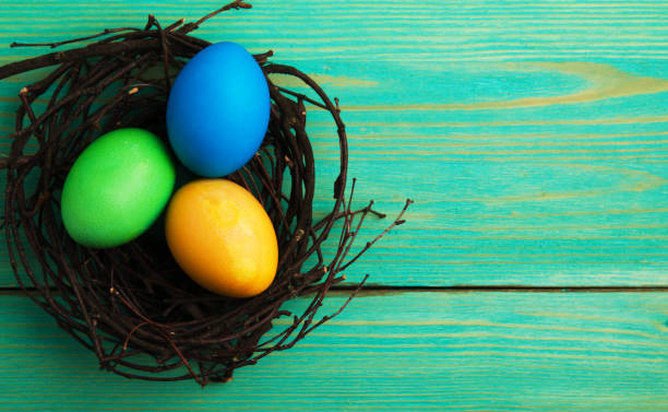istock Easter eggs on a wooden background .Easter eggs of different colors .Easter eggs top view 940731030