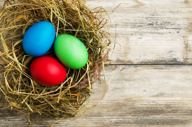 istock Easter eggs on a wooden background .Easter eggs of different colors .Easter eggs top view 940731036