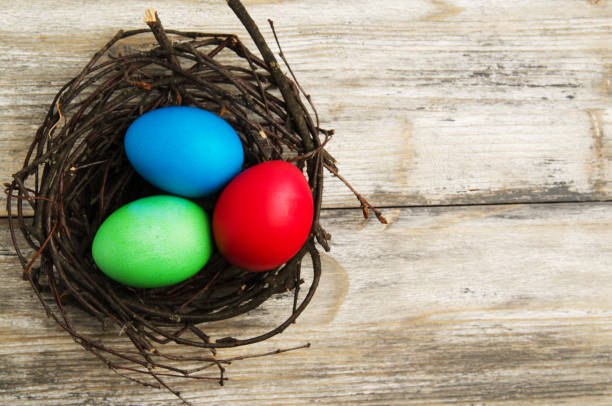 istock Easter eggs on a wooden background .Easter eggs of different colors .Easter eggs top view 940731042