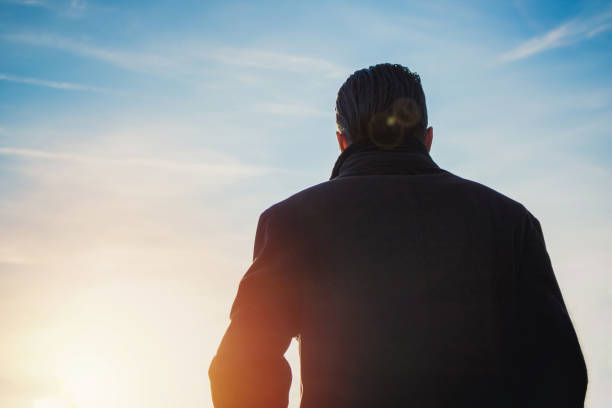 istock Back view of man against the sky. 940753832