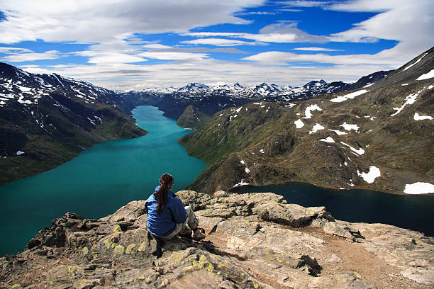 Hiking. Hiker taking a break at the spectacular Bessegen view in Jotunheimen, Norway.