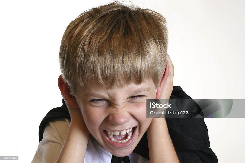 Halloween:  The Scream Young boy in black cape practicing a Halloween scream. Acting - Performance Stock Photo