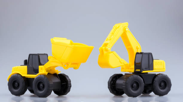 istock Heavy duty construction backhoe and Tractor toy on clear background. 940773636