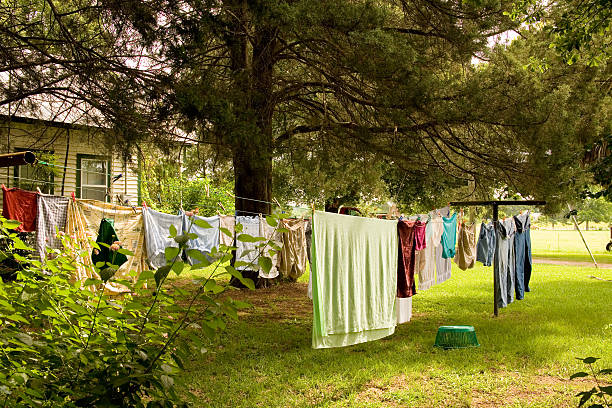 istock Clothesline full of clothes on a farm 94077392