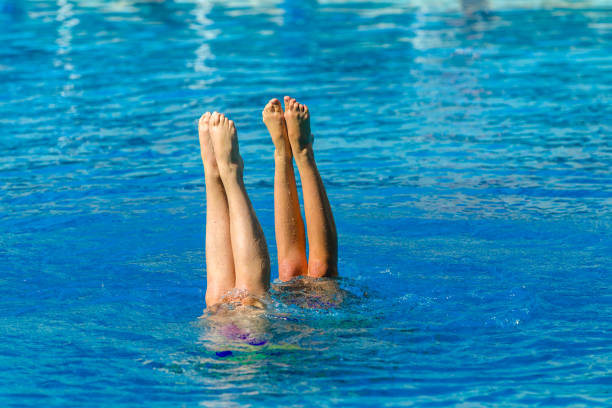 istock Aquatic Synchronised Swimmers Underwater 940791560