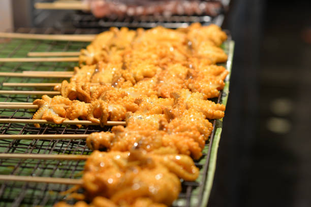 istock Grilled squid in wood stick prepare for eat 940791626