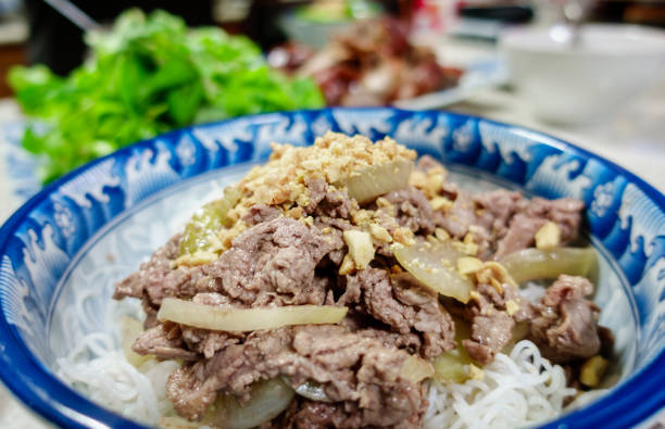 istock Bun bo xao; a classic Vietnamese beef noodle salad meal 940823776