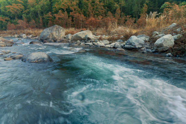istock River water flowing through rocks at dawn 940832498