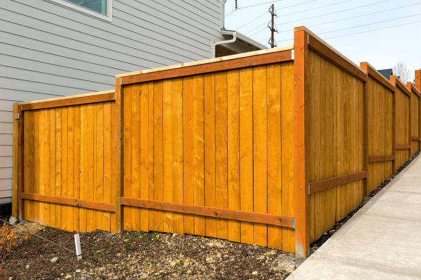 istock New home backyard wood fence construction 940833720