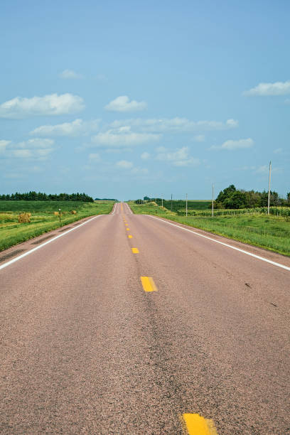 istock Summer day and an asphalt road 940839244