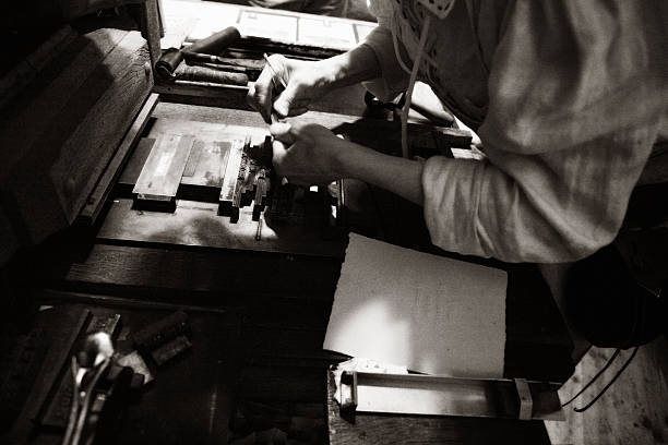 Typo Printer working in an old shop. typesetter stock pictures, royalty-free photos & images