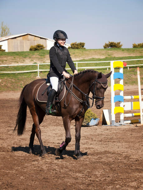 istock Happy young girl after winning on showjumping competition 940853214