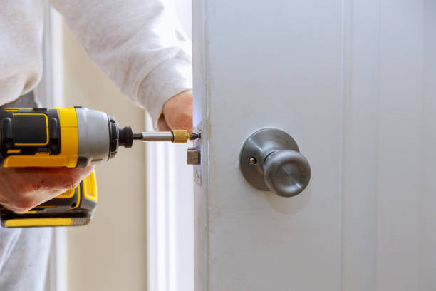 istock Hands repairing a door lock with a screwdriver 940856774