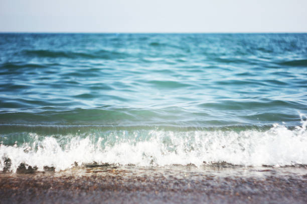 istock Sea wave and wet sand. Summer and holiday concept 940859156