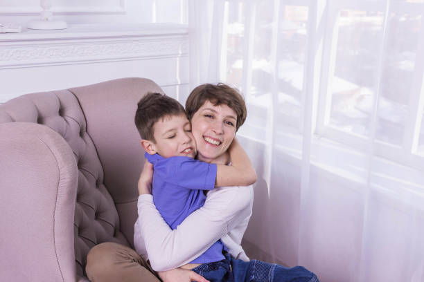 istock Mother's Day concept: Happy smiling mother and son 940859348
