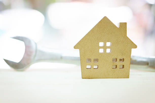 istock Model house and wrench, home services. Home repairs concept. 940868272