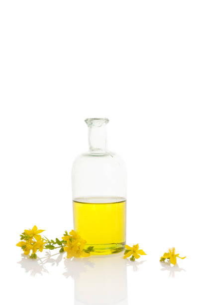istock St. John's wort oil in glass bottle. 940872790