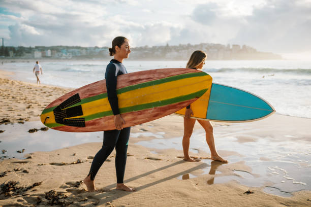istock Courageous female surfers 940892214
