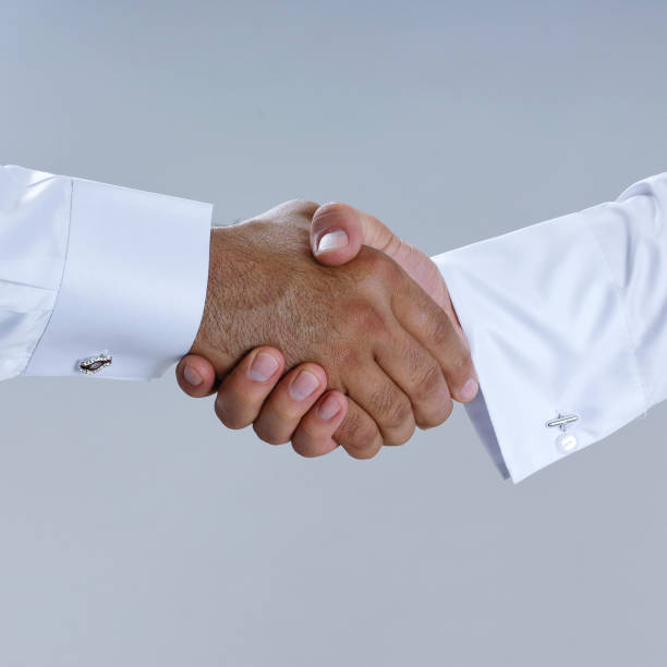 istock Saudi Arab Businessmen Hands Shaking, Making Agreement and Welcoming Closeup 940895176