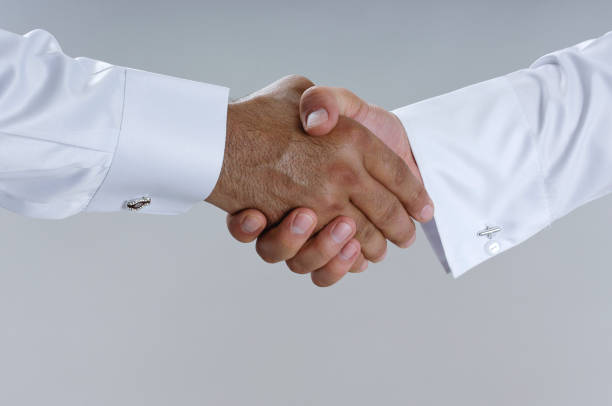 istock Saudi Arab Businessmen Hands Shaking, Making Agreement and Welcoming Closeup 940895206