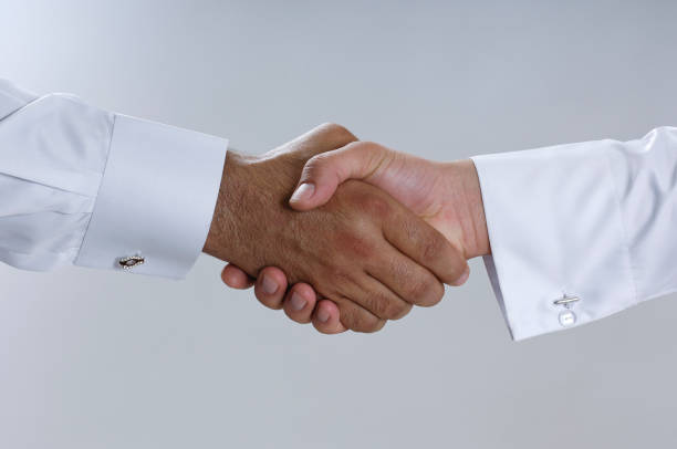 istock Saudi Arab Businessmen Hands Shaking, Making Agreement and Welcoming Closeup 940895230