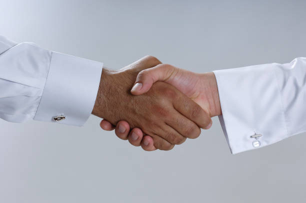 istock Saudi Arab Businessmen Hands Shaking, Making Agreement and Welcoming Closeup 940895244