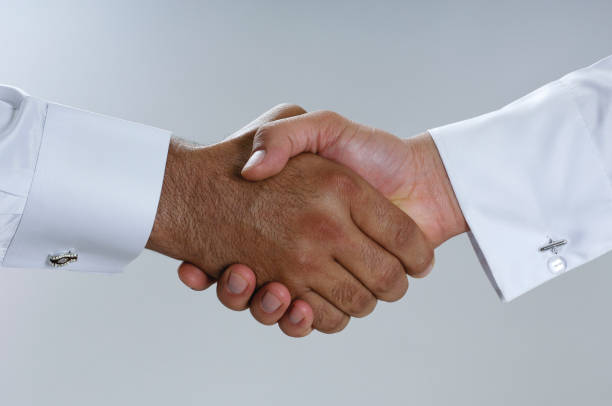 istock Saudi Arab Businessmen Hands Shaking, Making Agreement and Welcoming Closeup 940895252