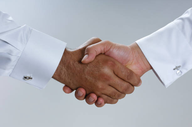 istock Saudi Arab Businessmen Hands Shaking, Making Agreement and Welcoming Closeup 940895280