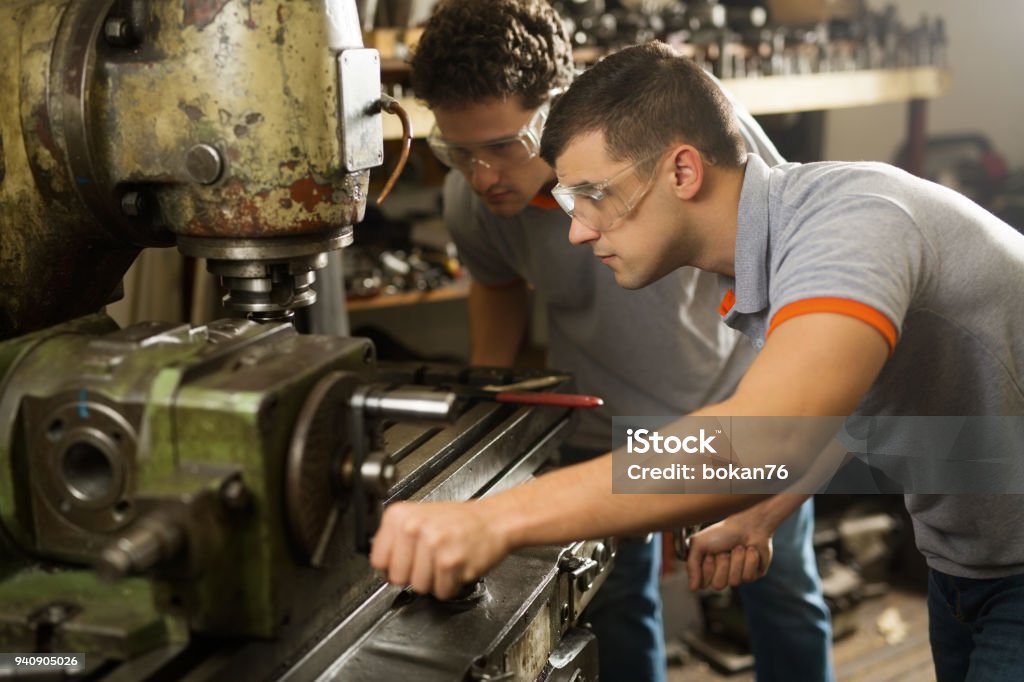 Two Metal Manual Wokers Milling Machine Stock Photo