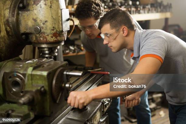 Two Metal Manual Wokers Stock Photo - Download Image Now - Milling Machine, Adult, Adults Only