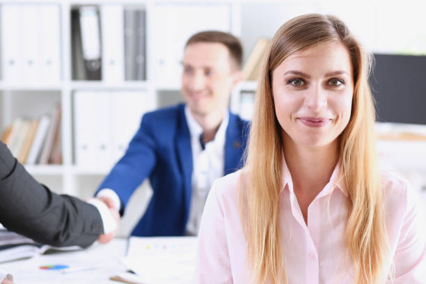 istock Beautiful smiling cheerful girl at workplace 940905636