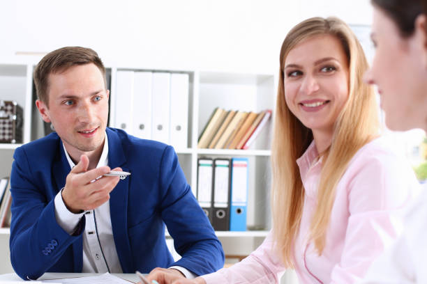 istock Beautiful smiling cheerful girl at workplace 940905698