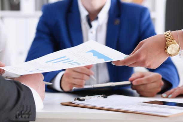 istock Group of people discuss financial results 940905824