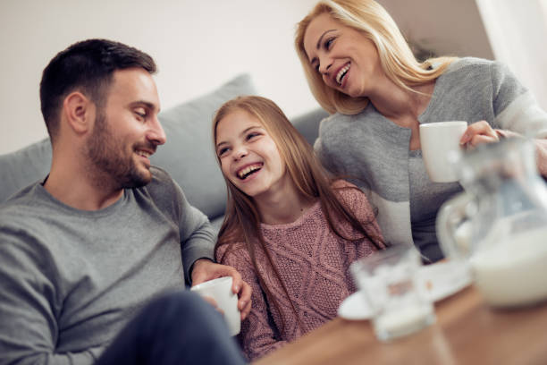 istock Happy young family having fun together 940910444