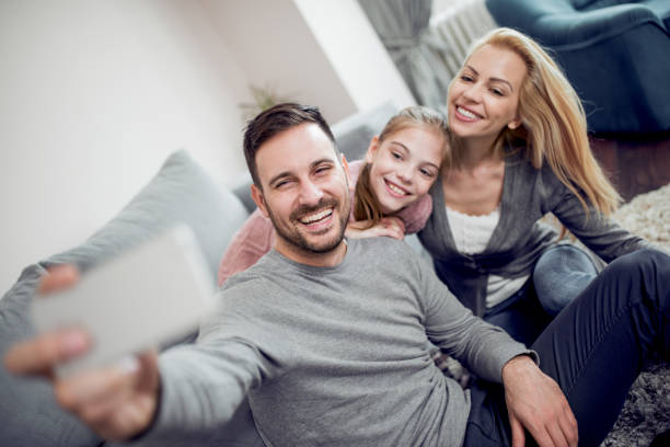 istock Happy young family having fun together 940910702