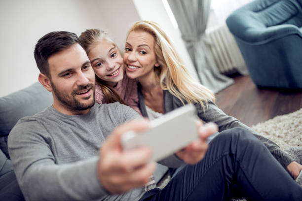istock Happy young family having fun together 940910710