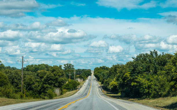 istock Road in Texas. Agricultural gardens 940914000