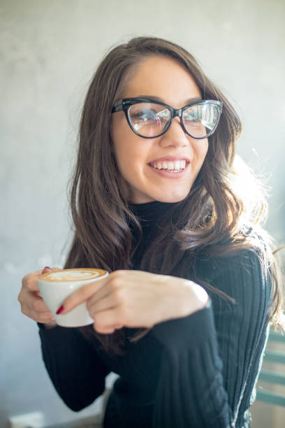 istock woman in a cafe drinking coffee 940915738