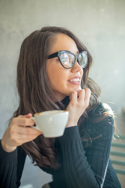 istock woman in a cafe drinking coffee 940915874