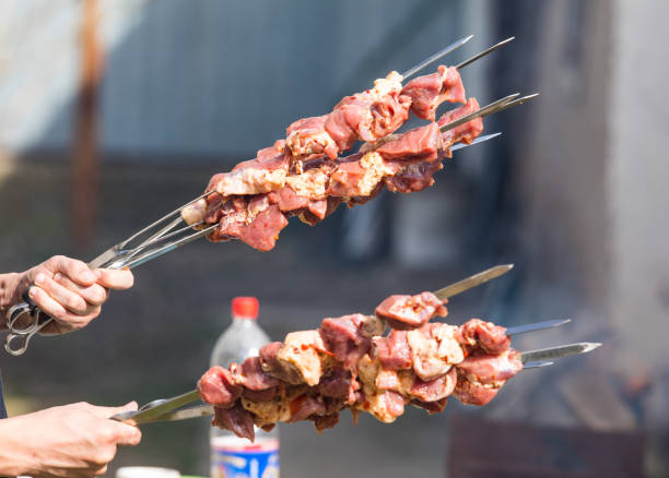 istock raw meat for barbecue on skewers 940920206