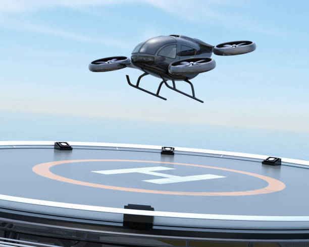 Black self-driving passenger drone takeoff from helipad Black self-driving passenger drone takeoff from helipad. 3D rendering image. tilt rotor stock pictures, royalty-free photos & images