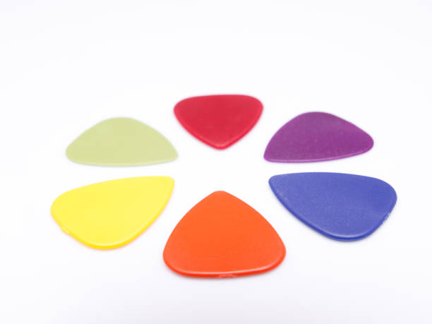 istock Guitar picks isolated in white background 940929844