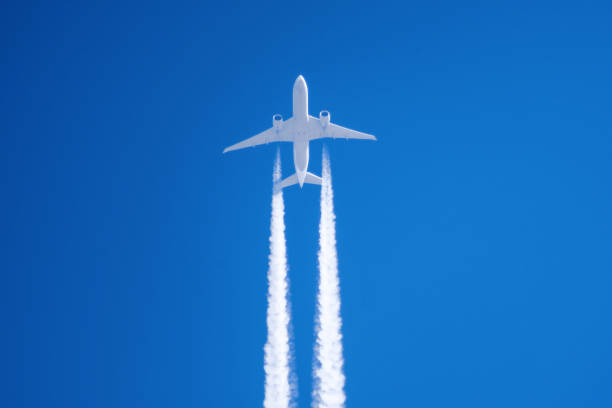 istock White big passenger airplane two engines aviation airport contrail clouds. 940932788