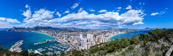 Panoramic view of Calpe-Comunidad Autonoma de Valencia, Spain. Copy space available for text and/or logo. Multiple images taken from Peñon de Ifach. DSRL outdoors photo taken with Canon EOS 5D Mk II and Canon EF 17-40mm f/4L IS USM Wide Angle Zoom Lens