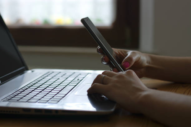istock Working at home and texting with the mobile phone 940933734