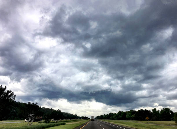 istock truck on the highway before a storm 940936900