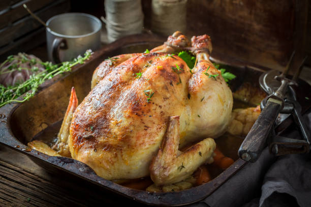 istock Tasty grilled chicken with thyme and carrots 940938002