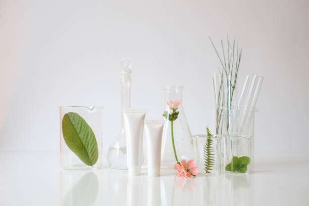 istock laboratory experiment and research with leaf, oil and ingredient  extract for natural beauty and organic skincare product the blank bottle for label ,bio science concept. alternative medicine. spa. 940941114
